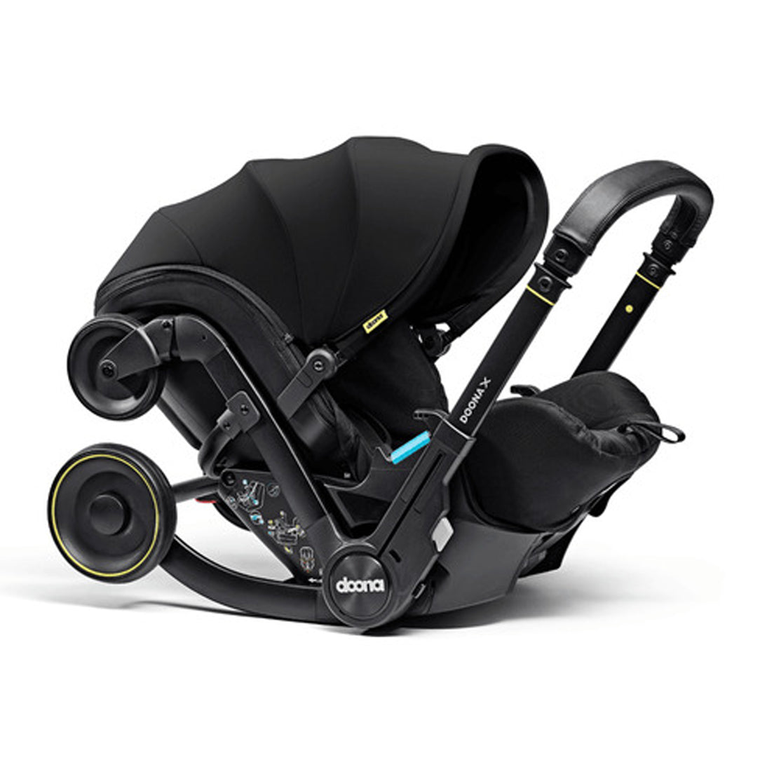DOONA X Infant Car Seat - Nitro Black & Free Essentials Bag - Gold