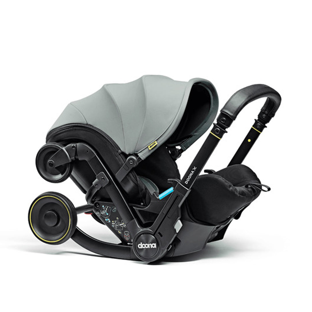 DOONA X Infant Car Seat - Dusty Sage & Free Essentials Bag - Gold
