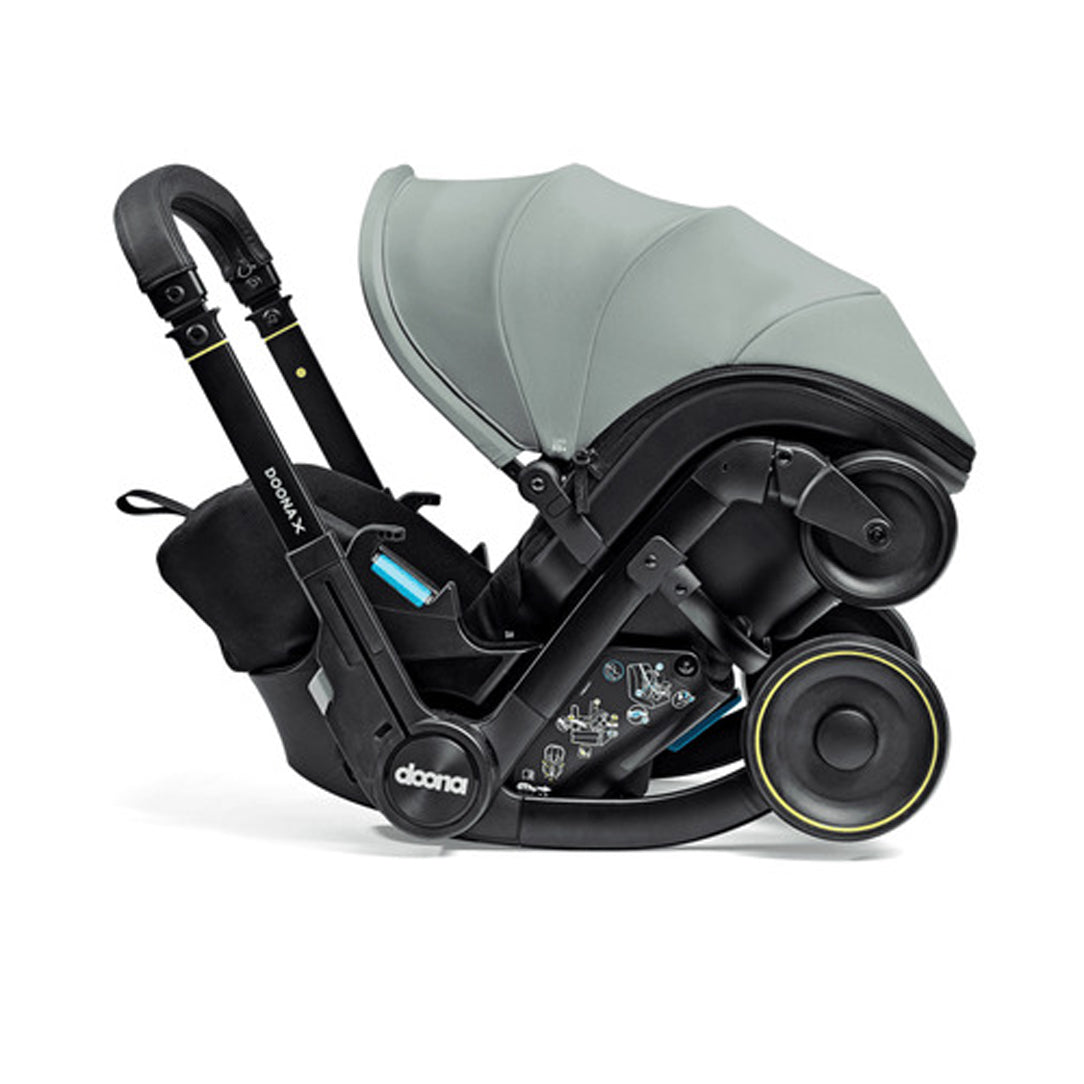 DOONA X Infant Car Seat - Dusty Sage & Free Essentials Bag - Gold