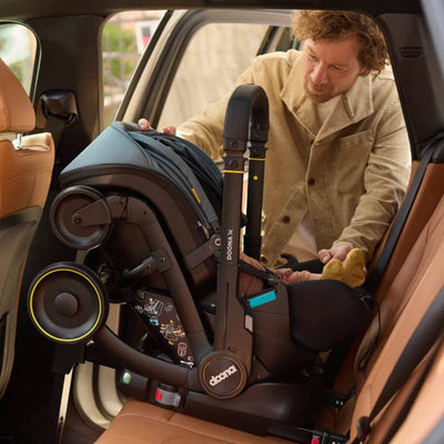 Bambinista - DOONA - Car Seats - DOONA X Infant Car Seat - Nitro Black & Free Essentials Bag - Gold